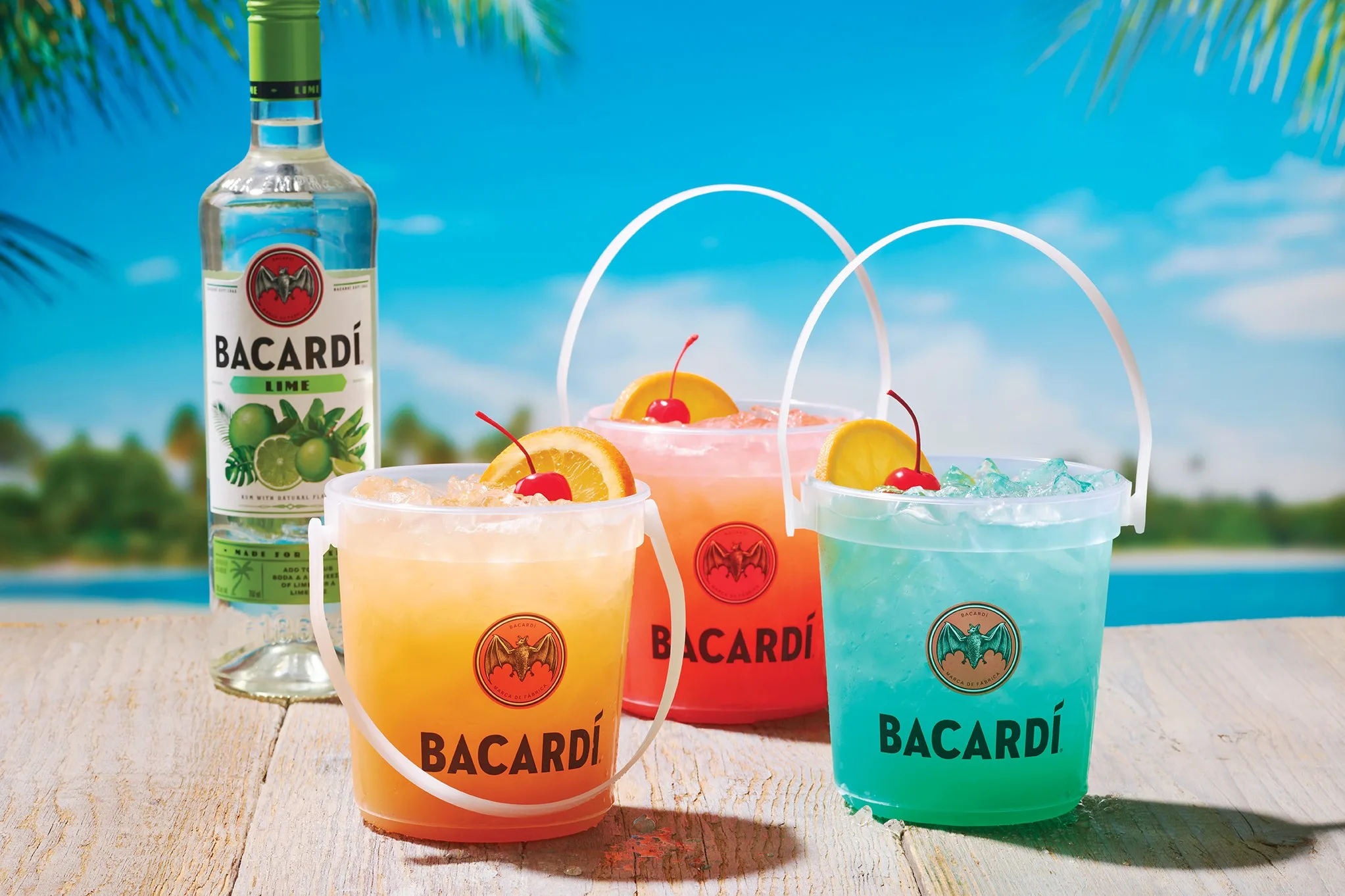 March 20, 2024 - Escape to paradise this spring and embrace the island flair of Applebee’s NEW $10 Bacardi Rum Buckets! Available in three tasty tropical flavors, Applebee’s Bacardi Rum Buckets feature premium spirits with Bacardi Superior and Bacardi Lime for only $10 served in an actual bucket!* Kick back “island style” with Applebee’s three NEW Bacardi Rum Buckets including: NEW Rum Breeze Bucket, a delicious cocktail made with Bacardi Superior Rum, Malibu Coconut Rum, blue curacao, lemon, pineapple juice and lemon lime soda. NEW Tropical Mama Bucket, a zesty twist on a Bahama Mama made with Bacardi Lime Rum, crème de banana liqueur, grenadine, pineapple and orange juice topped with lemon lime soda. NEW Party on the Beach Bucket, a tasty treat featuring Bacardi Lime Rum, peach schnapps, passion fruit, pineapple and orange juice. For traditional deal seekers, toast to spring with Applebee’s NEW Spring Break Sips! Say “adios” to winter blues with the NEW $5 ADIOS, a blue Long Island Iced Tea made with Smirnoff Vodka, Bacardi Superior Rum, Tanqueray Gin, blue curacao, and premium lemon sour topped with lemon lime soda, served in Applebee’s signature Mucho glass. Plus, guests looking for a “buzz-free" beach experience can enjoy the NEW non-alcoholic $4 Mocktail on the Beach, featuring Ocean Spray® Cranberry, orange juice, and peach and Starry® lemon lime soda. Source: Business Wire Applebee's launches NEW Bacardi Rum Buckets in three tropical flavors full of island flair. (Photo: Business Wire)