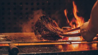 person barbecuing meat