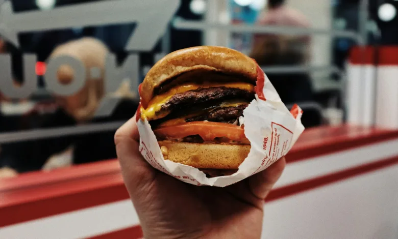 person holding hamburger